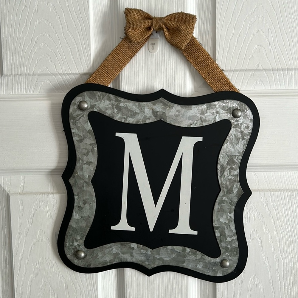 Decorative initial “M” hanging